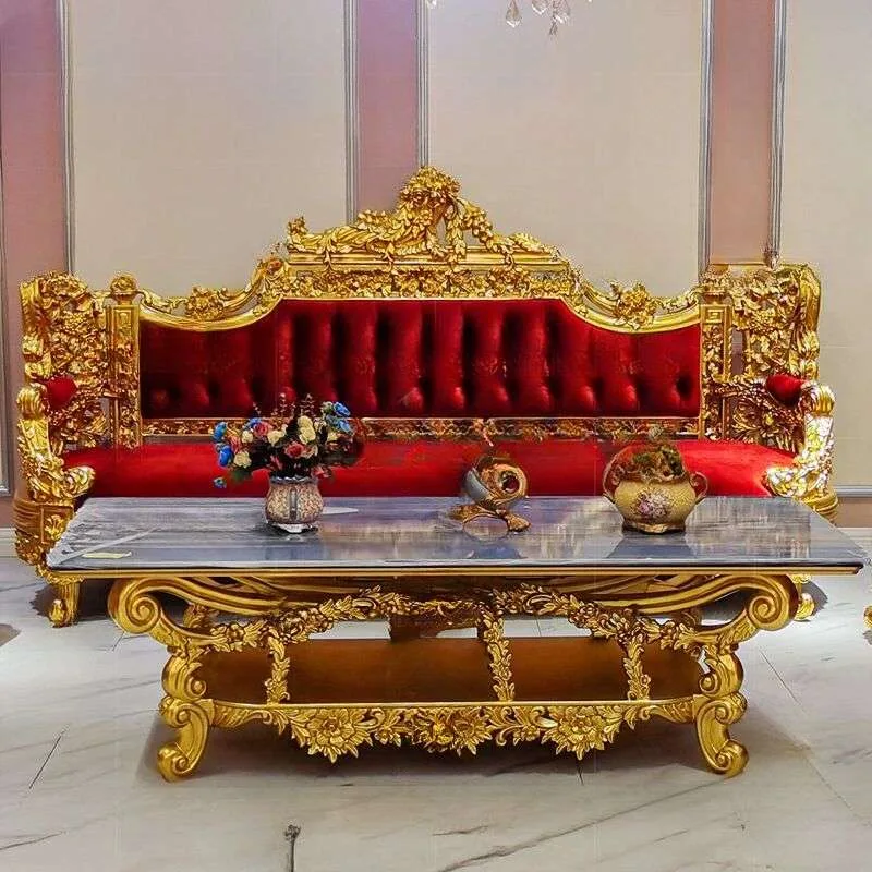 Gilded Royal Baroque Red Velvet Sofa Set featuring deep button tufting, heavy gold leaf floral carving, and a matching